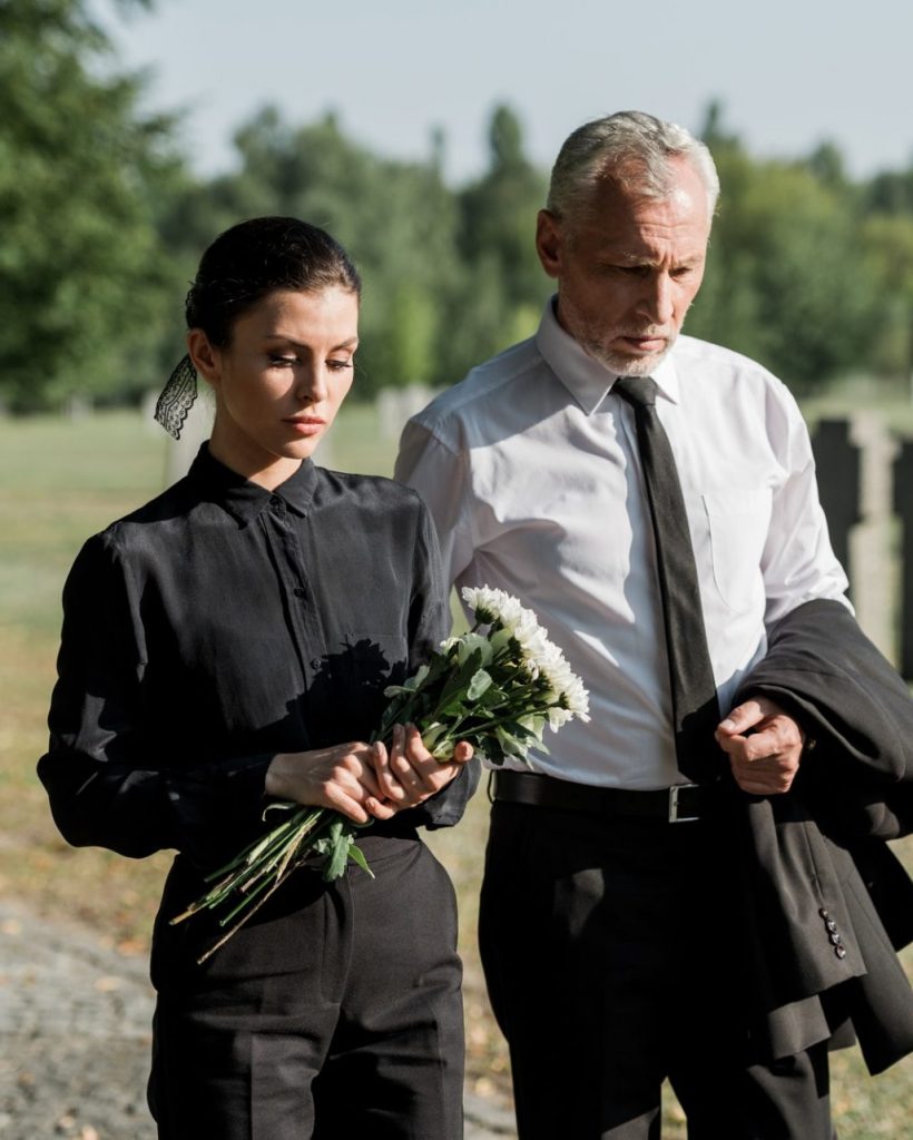 bearded-senior-man-walking-near-woman-with-flowers-on-funeral-e1636904705190-pg248vgfzuf1j1tb2rcwe1pf3gl4ik7a05hr8evlkw